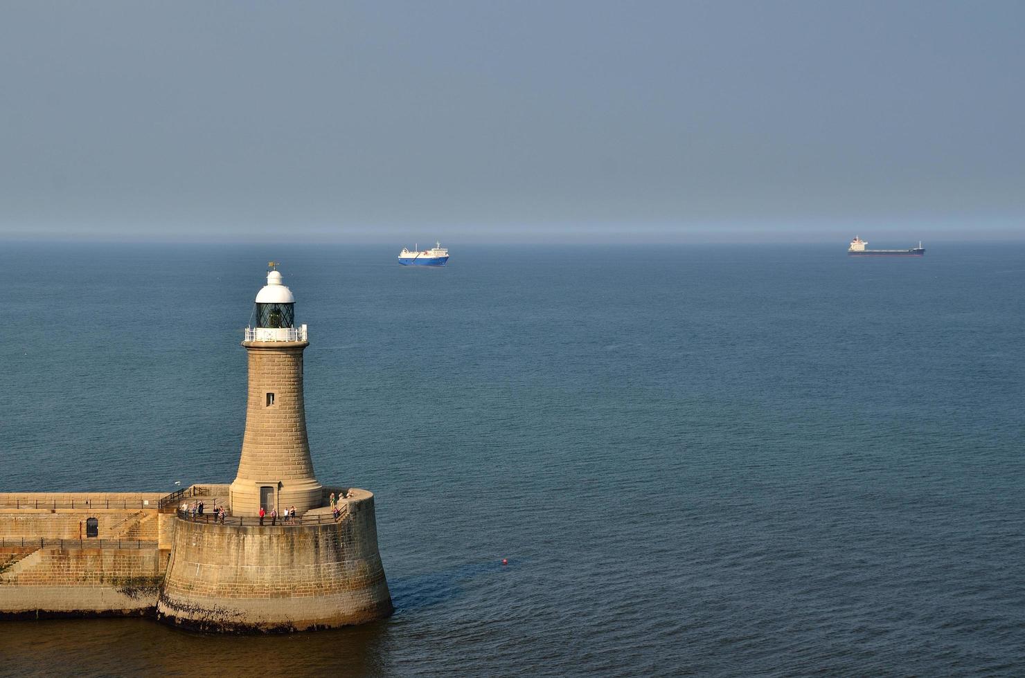 lighthouse and ships photo