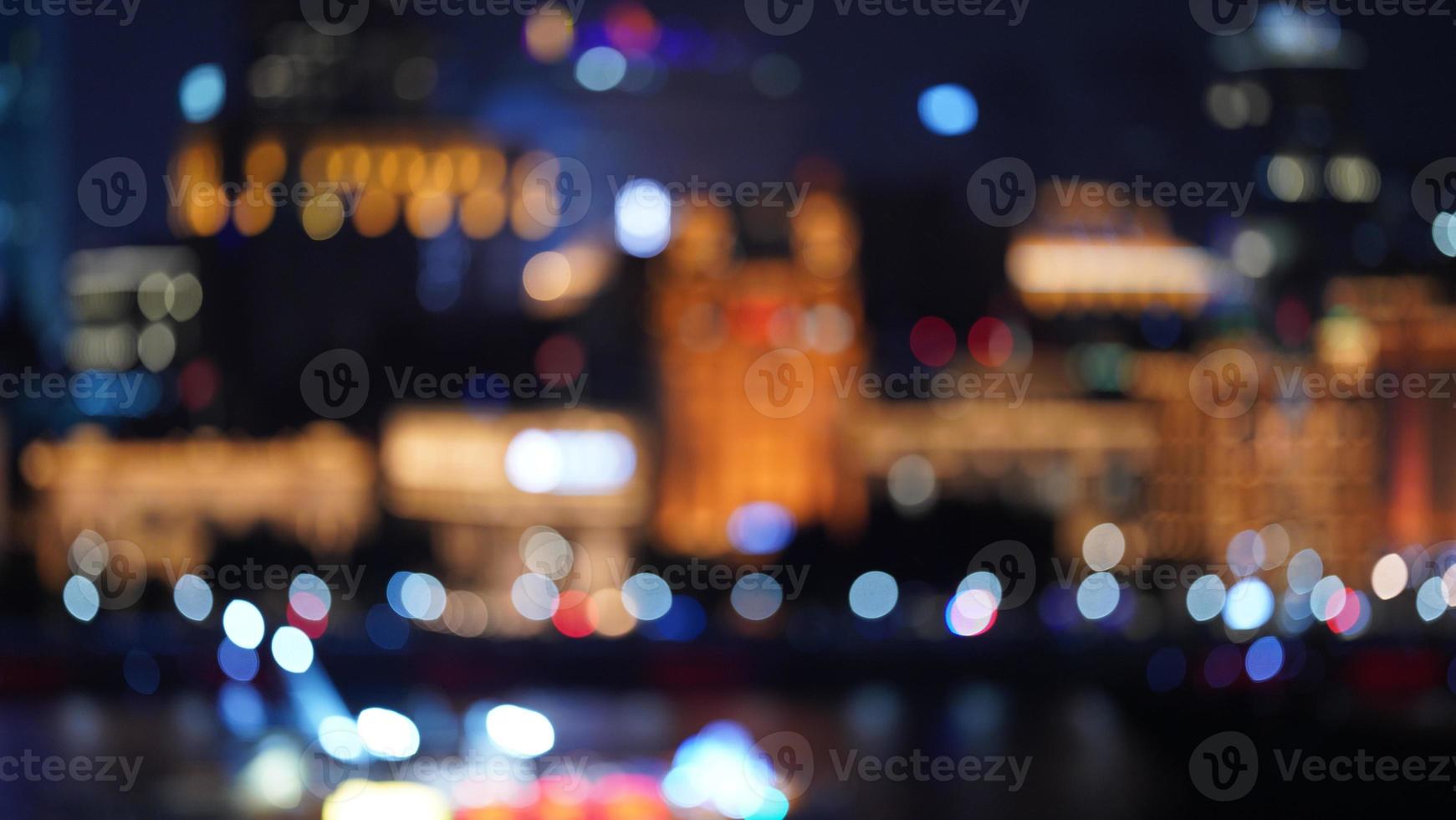 The blurred city view with the lights on at night photo