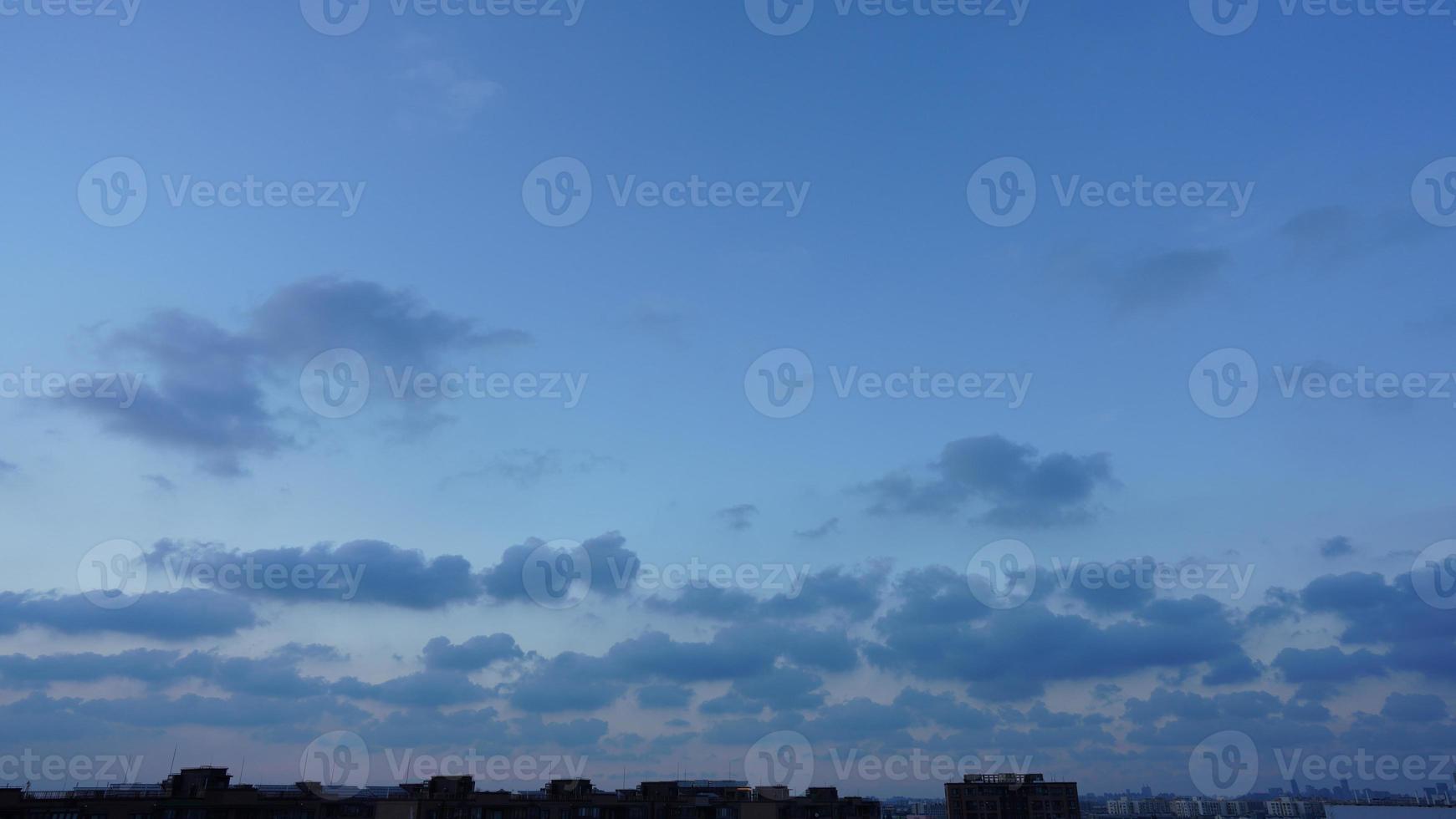 The beautiful sunset view with the silhouette and colorful clouds sky in the city photo