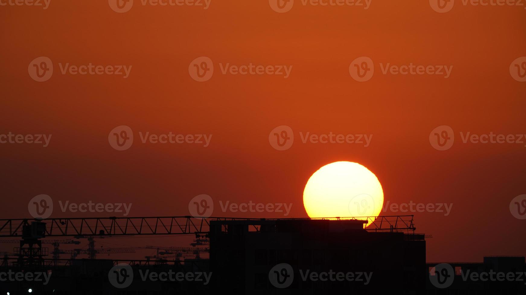 The beautiful sunset view with the silhouette and colorful clouds sky in the city photo