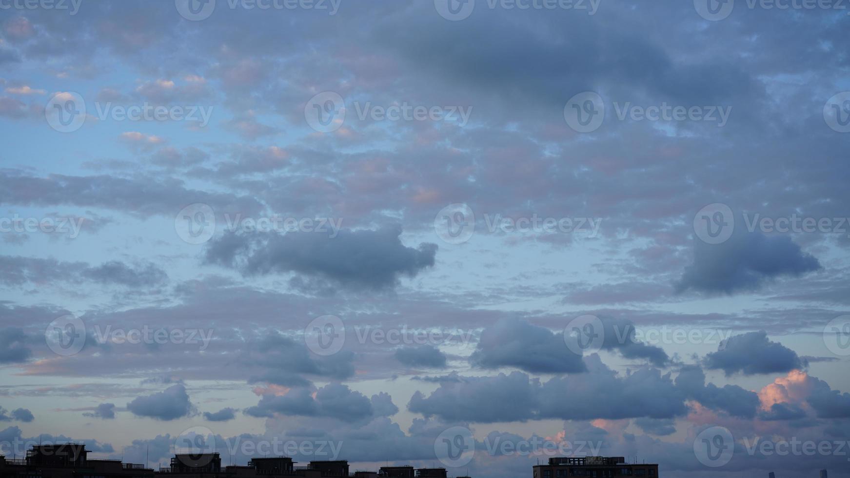 The beautiful sunset view with the silhouette and colorful clouds sky in the city photo
