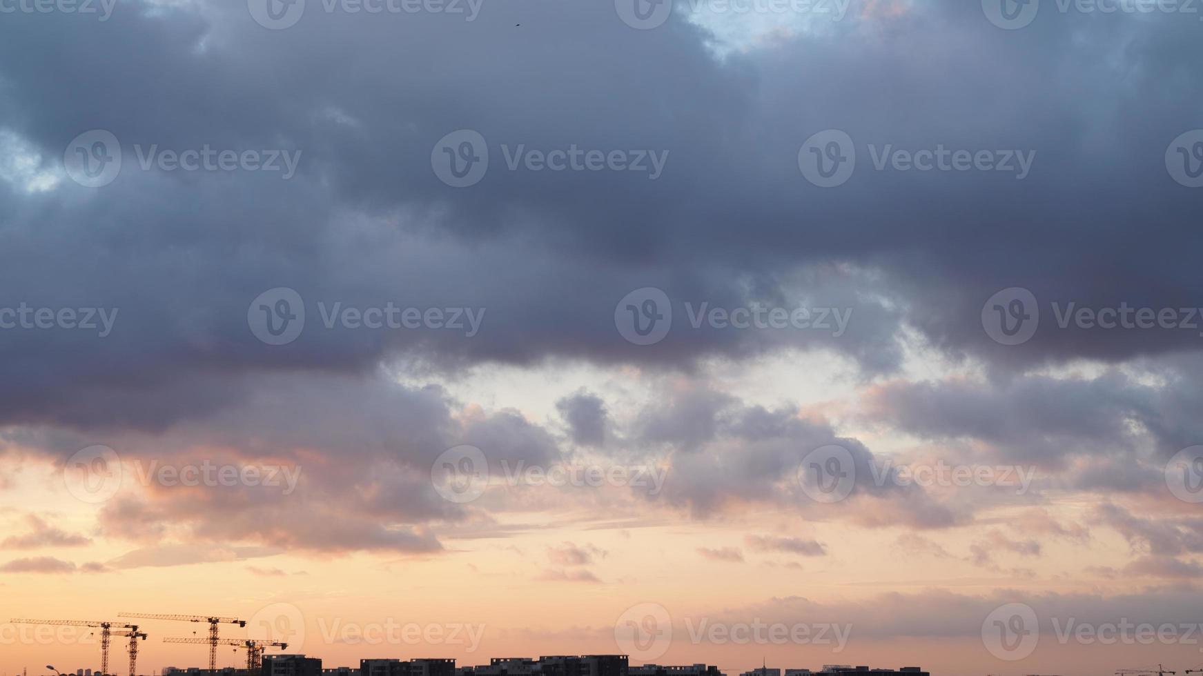 The beautiful sunset view with the silhouette and colorful clouds sky in the city photo