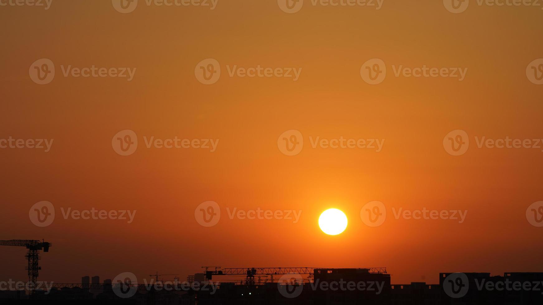 The beautiful sunset view with the silhouette and colorful clouds sky in the city photo