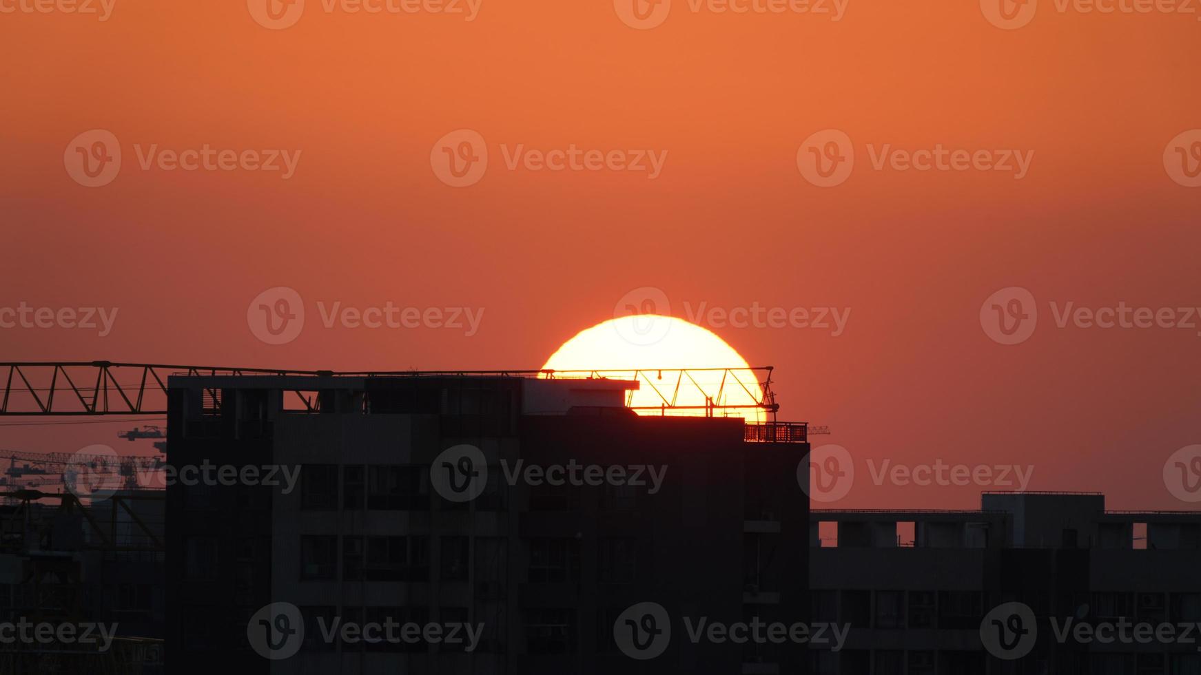 The beautiful sunset view with the silhouette and colorful clouds sky in the city photo