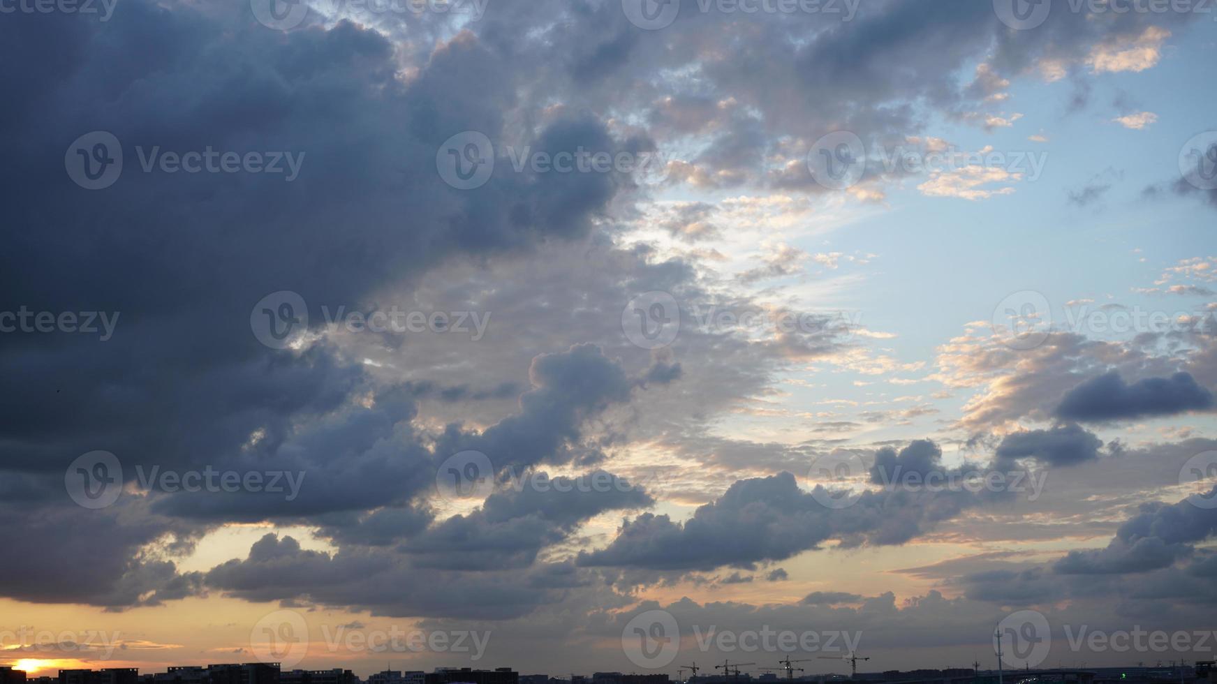 The beautiful sunset view with the silhouette and colorful clouds sky in the city photo