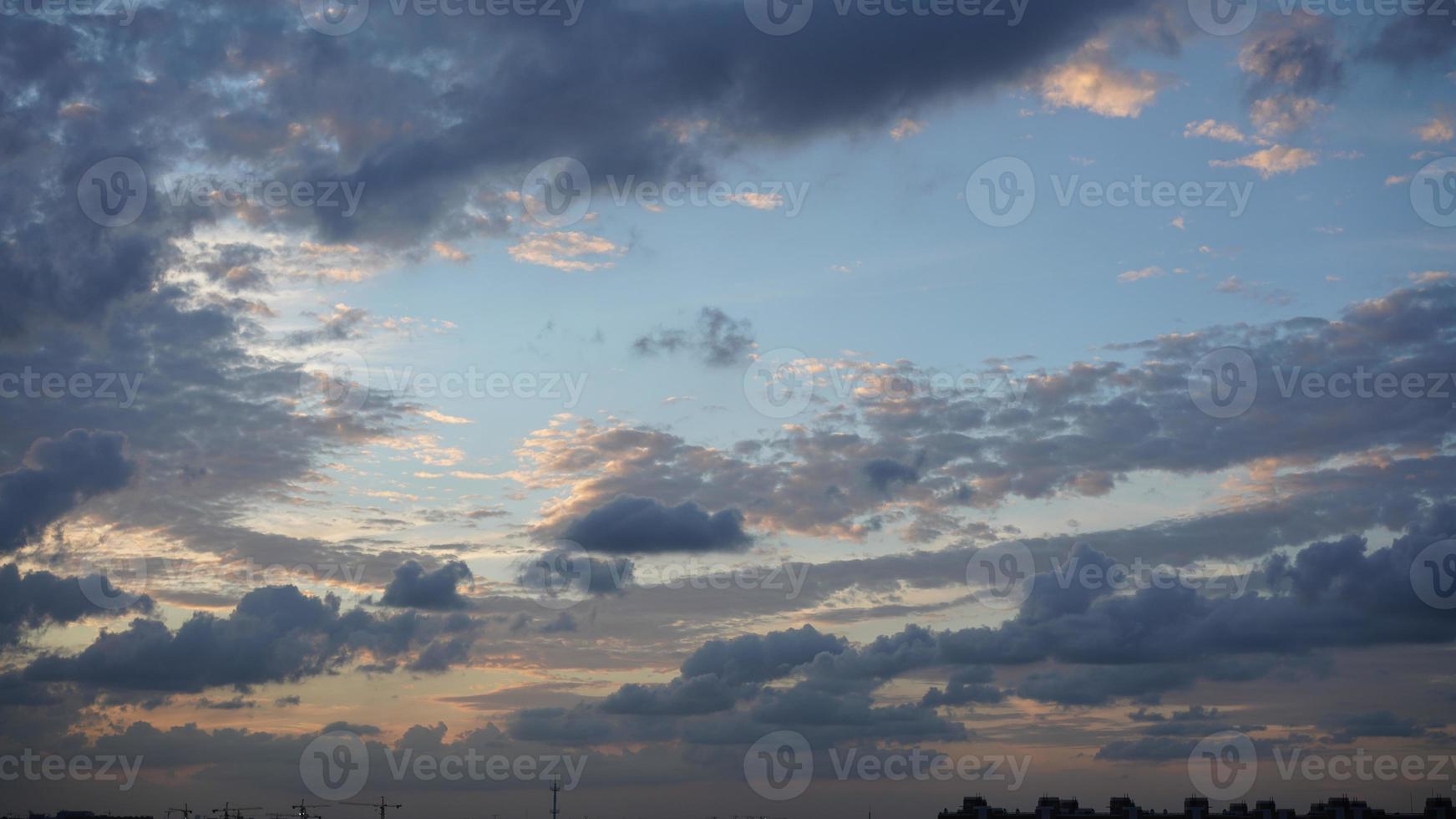 The beautiful sunset view with the silhouette and colorful clouds sky in the city photo