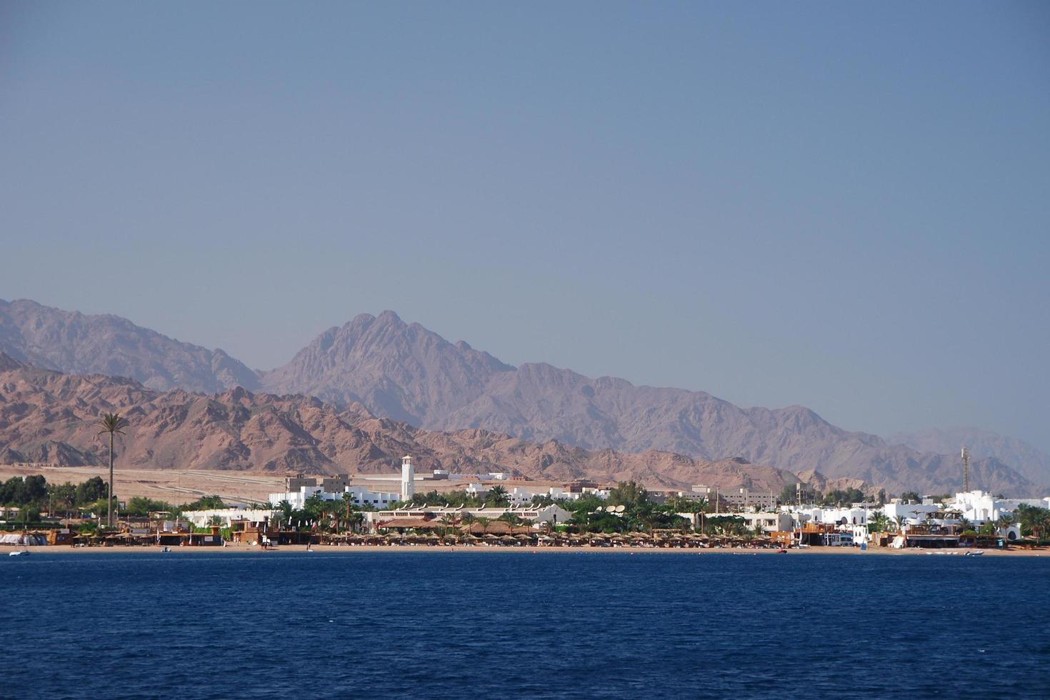 town on the beach in egypt with mountains photo