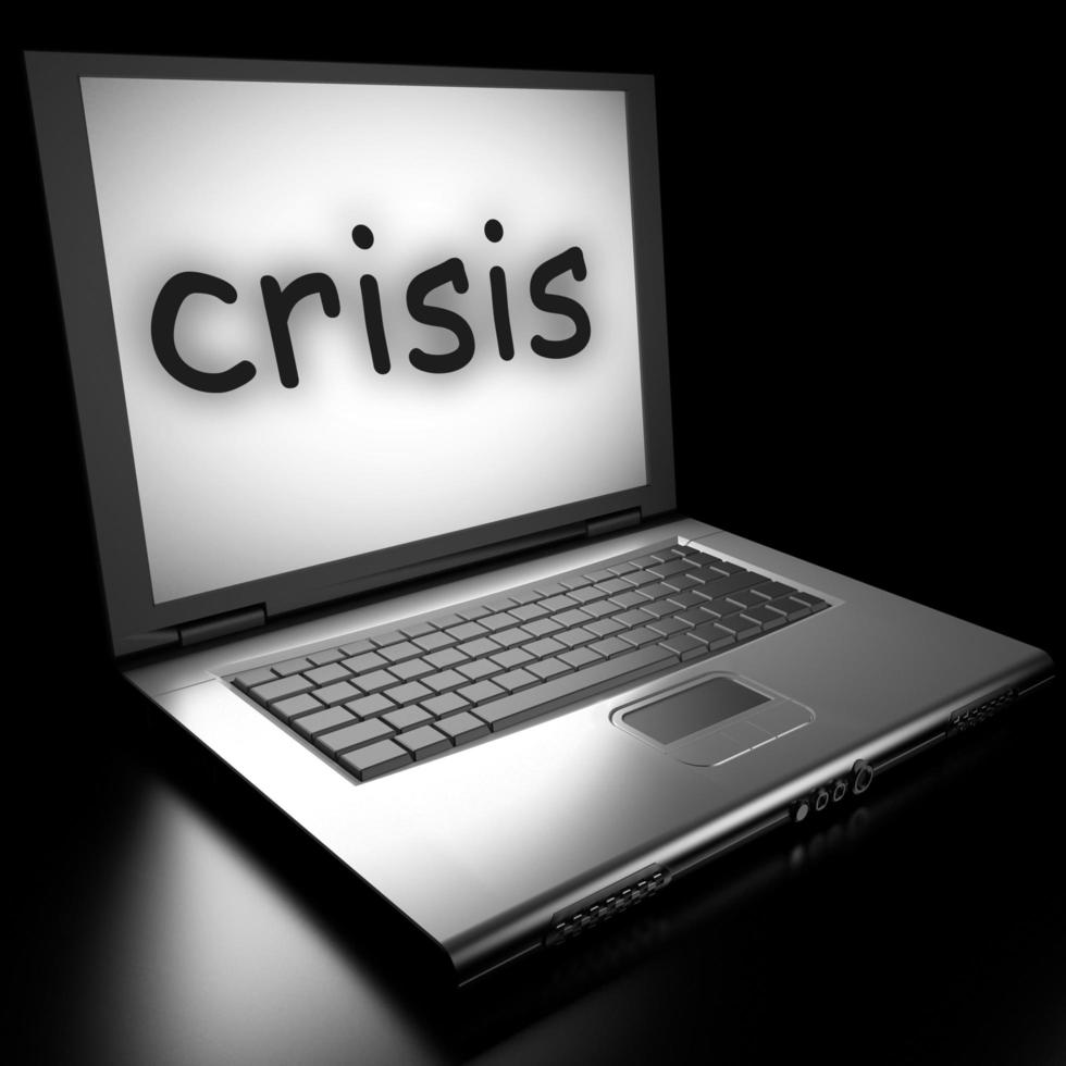 crisis word on laptop photo