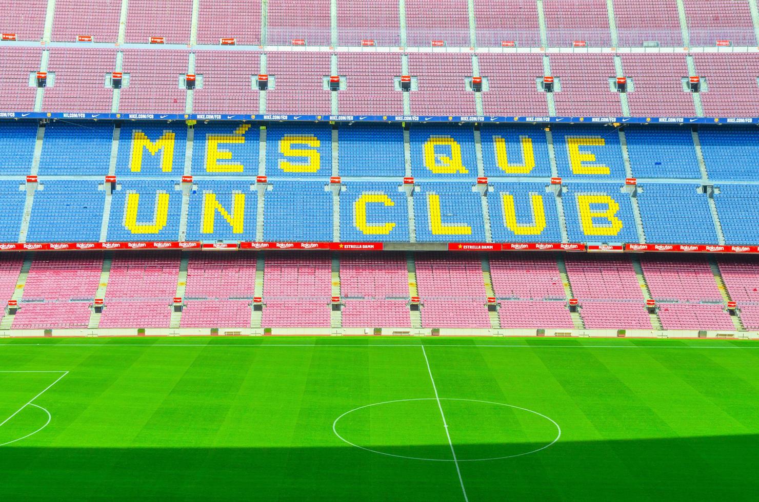 Barcelona, Spain, March 14, 2019 Camp Nou is the home stadium of football club Barcelona, the largest stadium in Spain. Top aerial view of tribunes stands and green grass field. photo