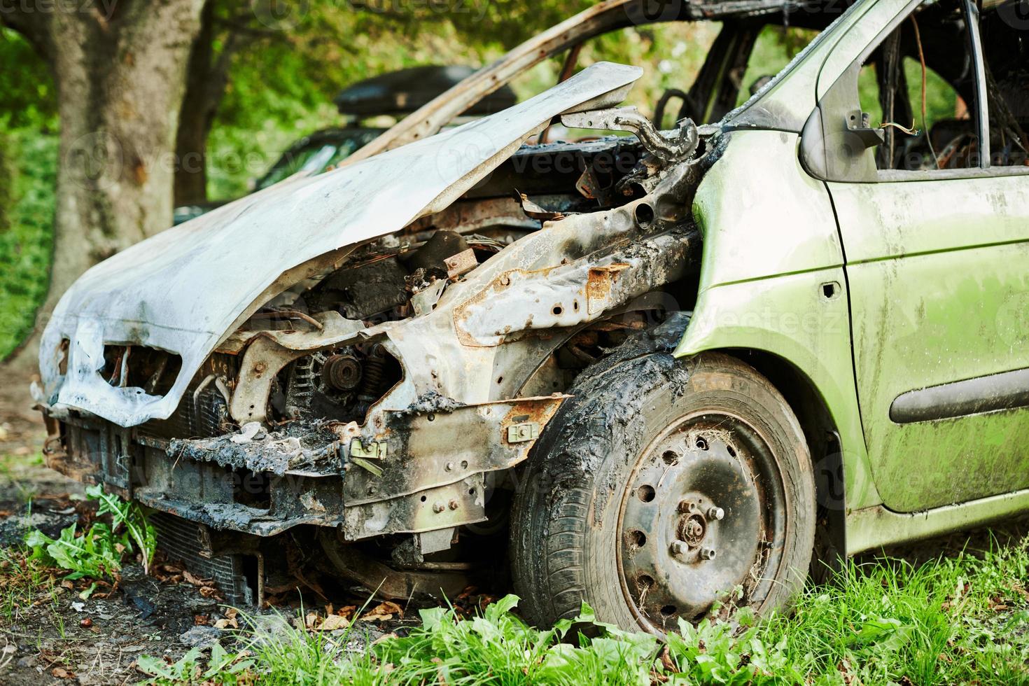 Burned car exterior, vehicle fire due to short circuit, arson, fire damaged motor vehicle, car fire photo