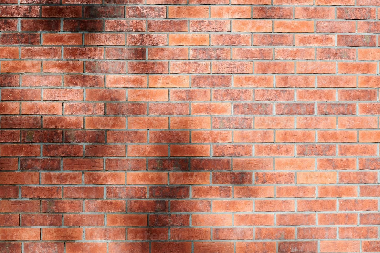 Red brick wall of loft building, red grunge brick wall background, loft texture, masonry brickwork photo