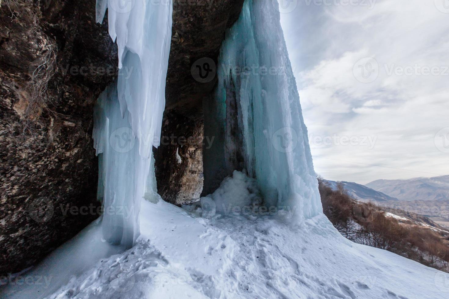 A large frozen waterfall. 3 cascading waterfall in Dagestan photo