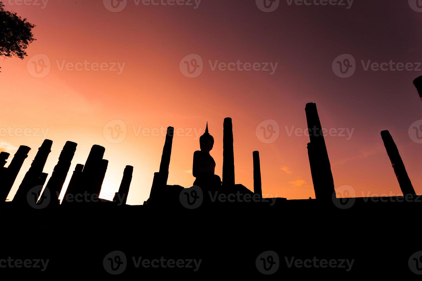 Silhouette Buddha Statue in Wat Mahathat Temple in Sukhothai Historical Park, Sukhothai Province, Thailand . photo