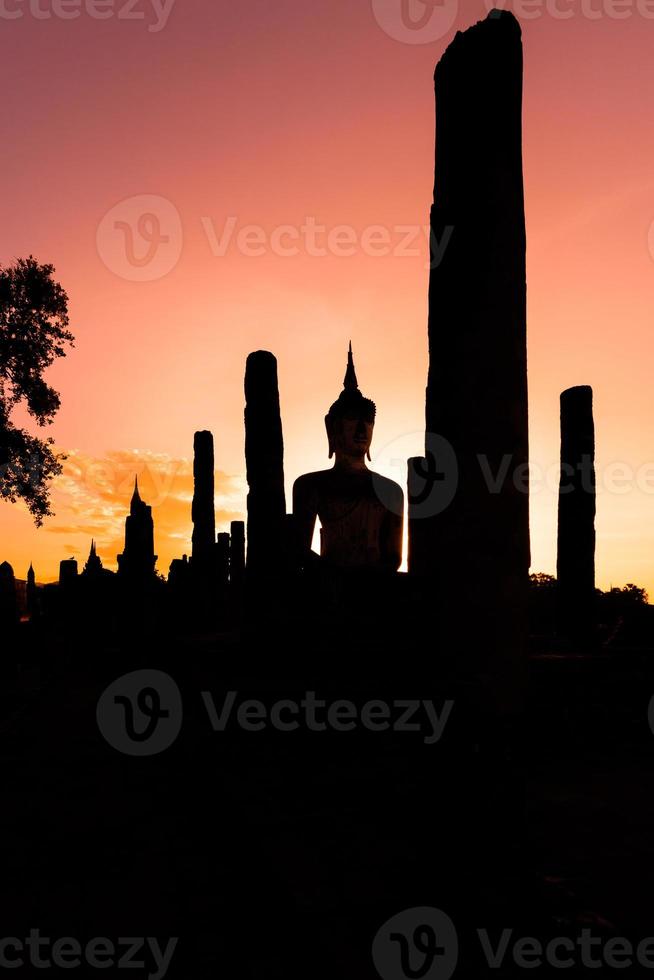 Silhouette Buddha Statue in Wat Mahathat Temple in Sukhothai Historical Park, Sukhothai Province, Thailand . photo