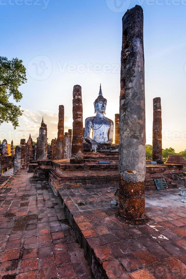 Silhouette Buddha Statue in Wat Mahathat Temple in Sukhothai Historical Park, Sukhothai Province, Thailand . photo