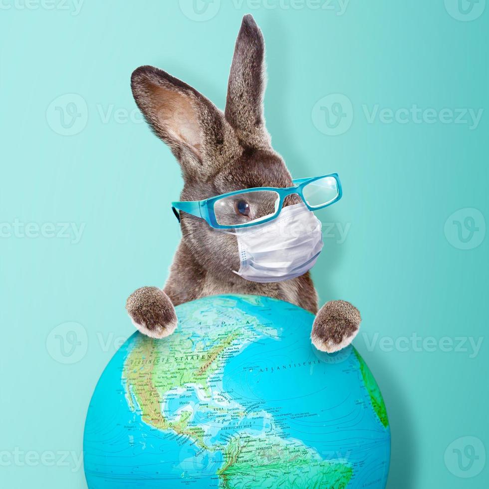 Easter rabbit with medical mask at epidemic time photo