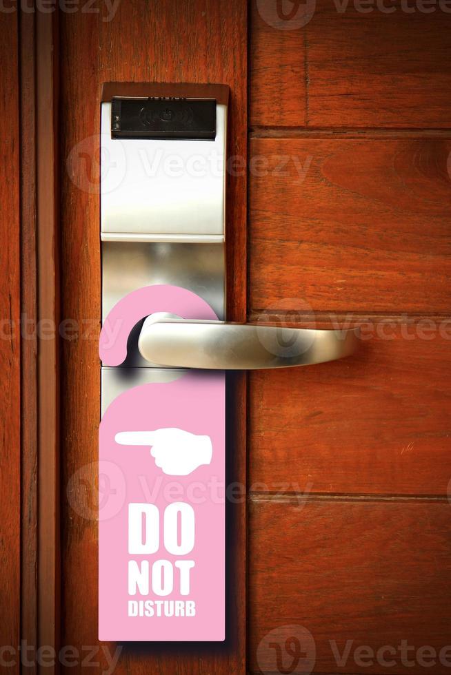 Do not disturb sign hang on door knob photo