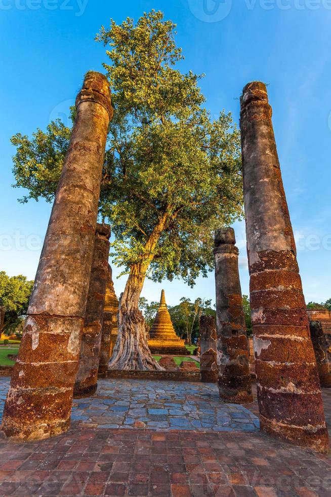 Silhouette Buddha Statue in Wat Mahathat Temple in Sukhothai Historical Park, Sukhothai Province, Thailand . photo