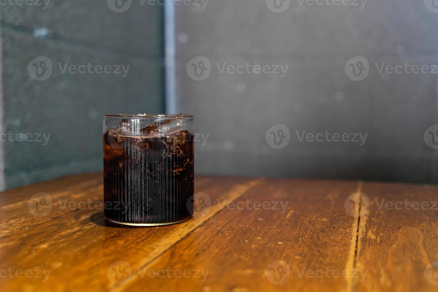 ice cola glass on table photo