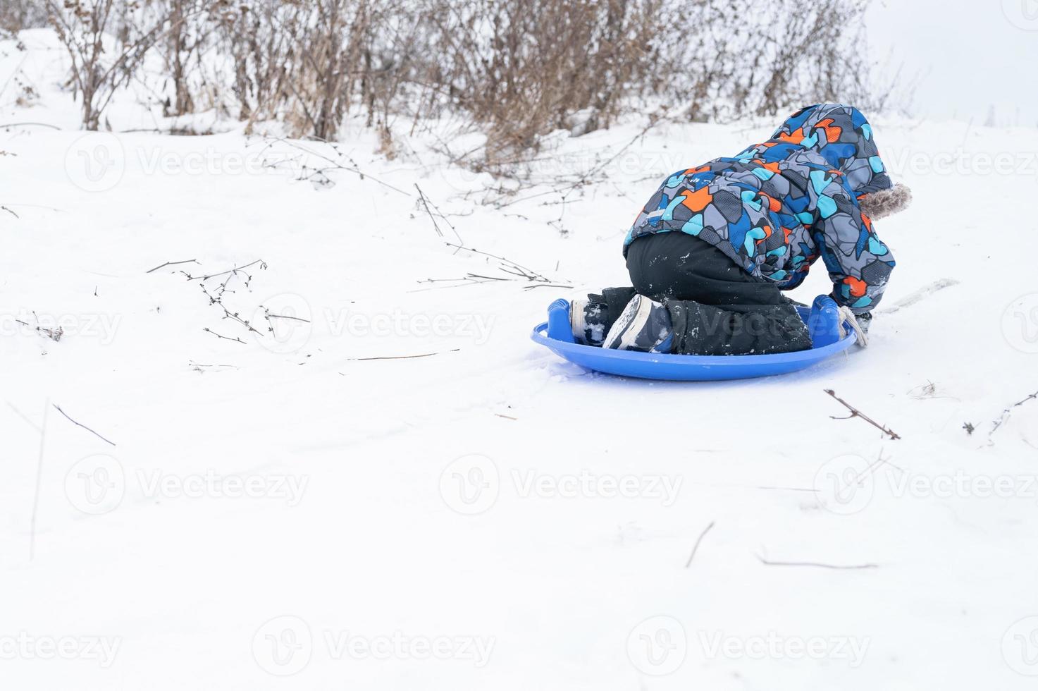 slide riding down kid winter activity photo