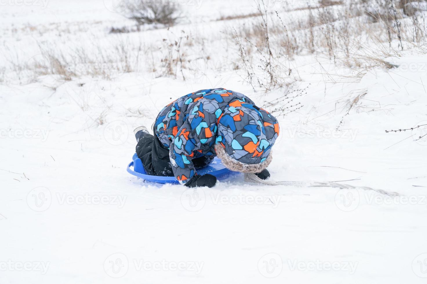 slide riding down kid winter activity photo