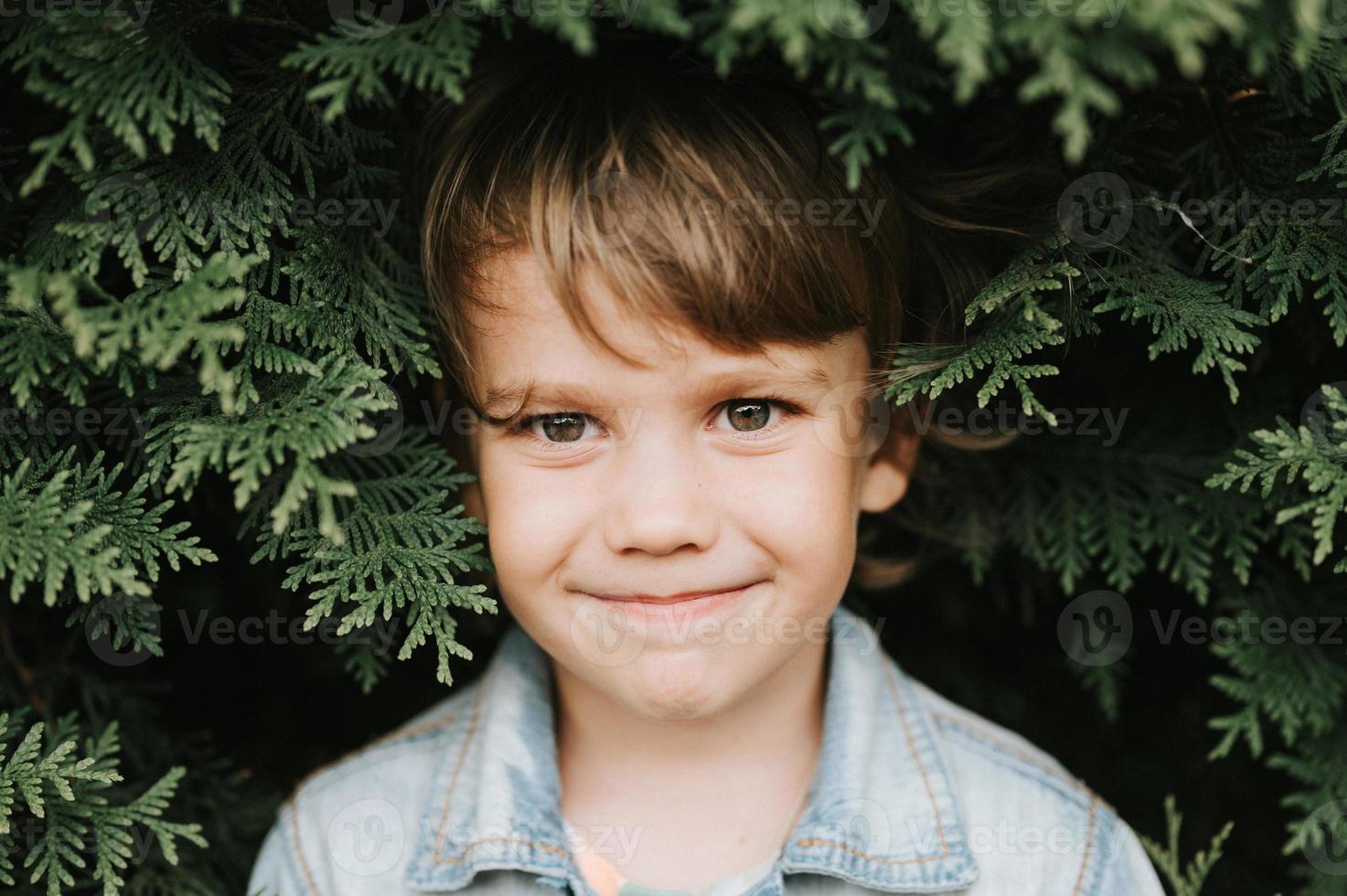 portrait kid boy plant photo