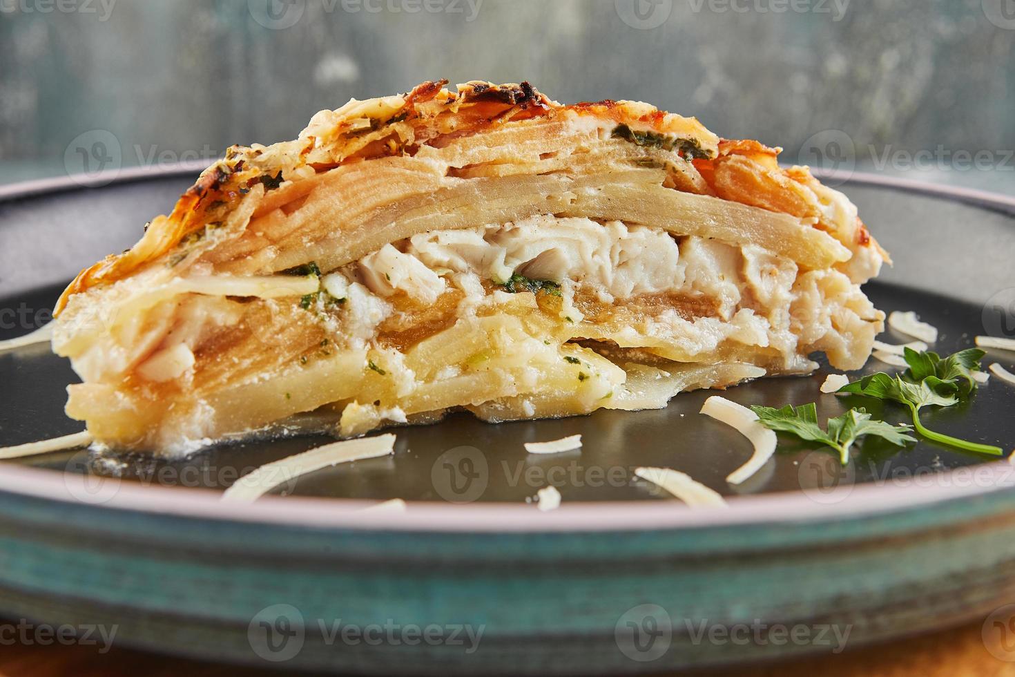 Fish gratin with potatoes and apples. Gourmet French food photo