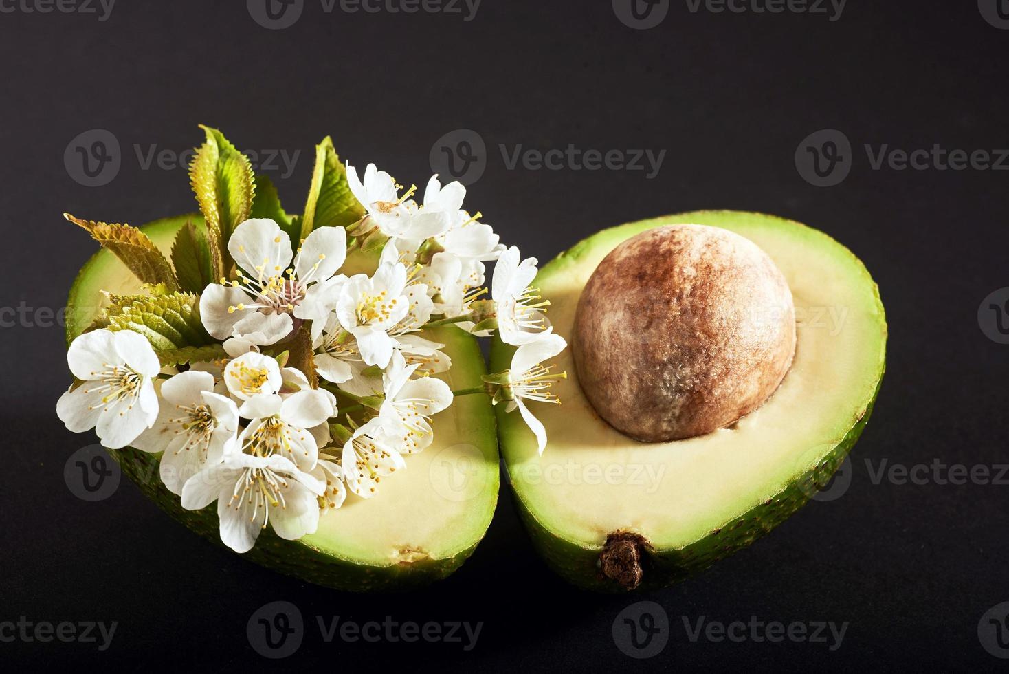 Fresh avocado on a black background. photo