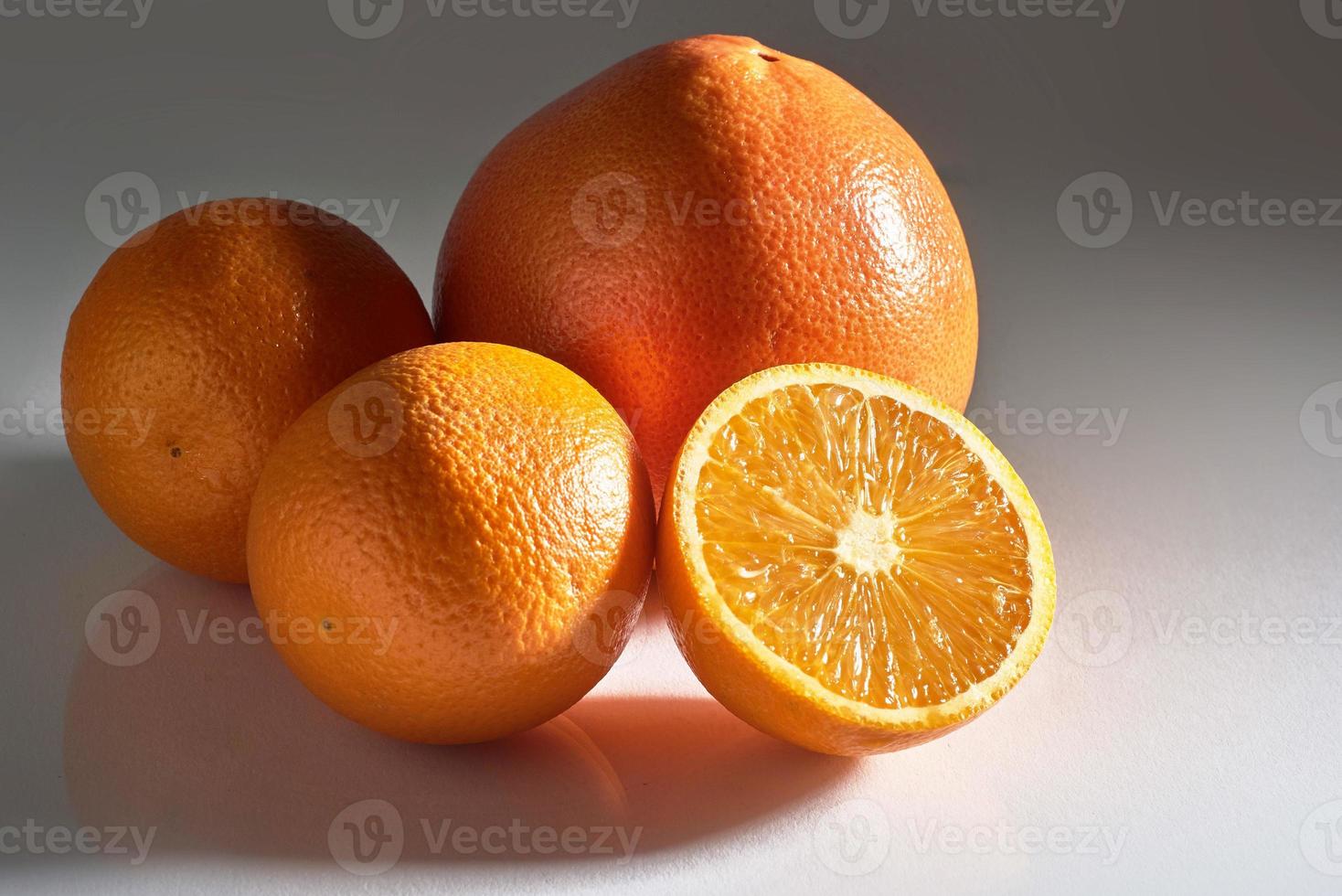 Delicious fresh oranges isolated on white background. photo