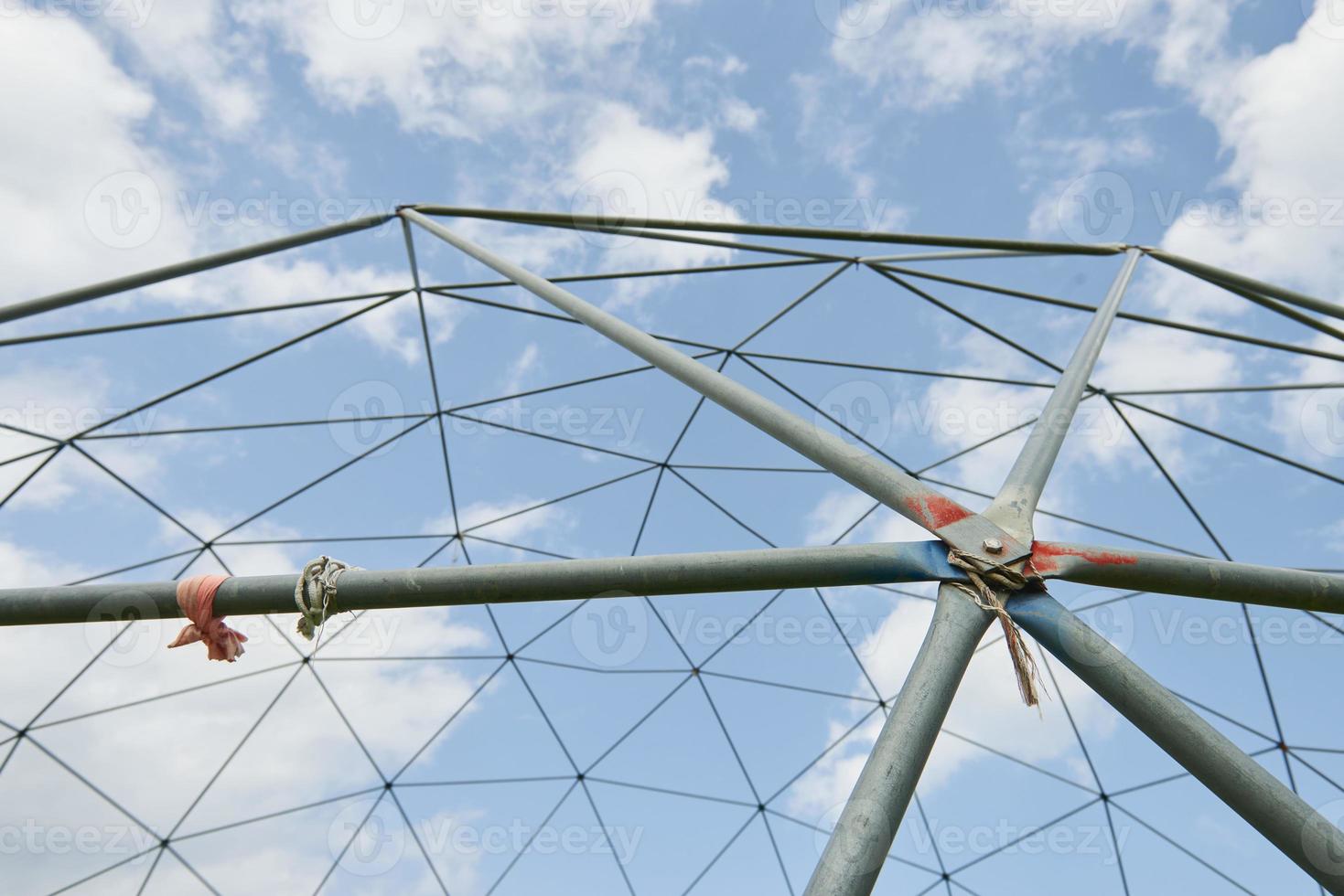 Metal structure against the blue sky. photo