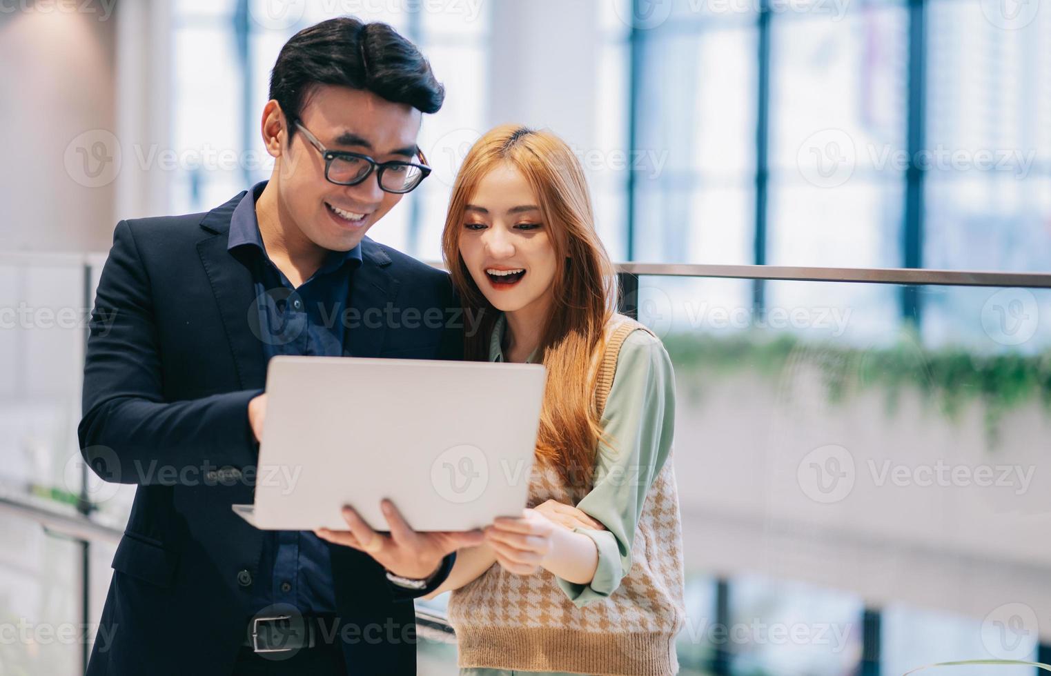 Portrait of young Asian business people at office photo
