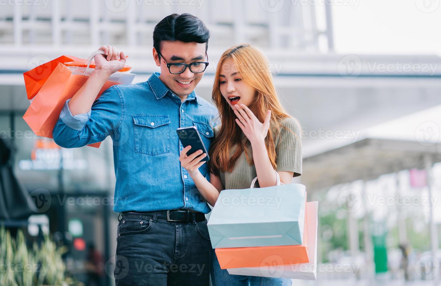 Asian couple shopping at the mall photo