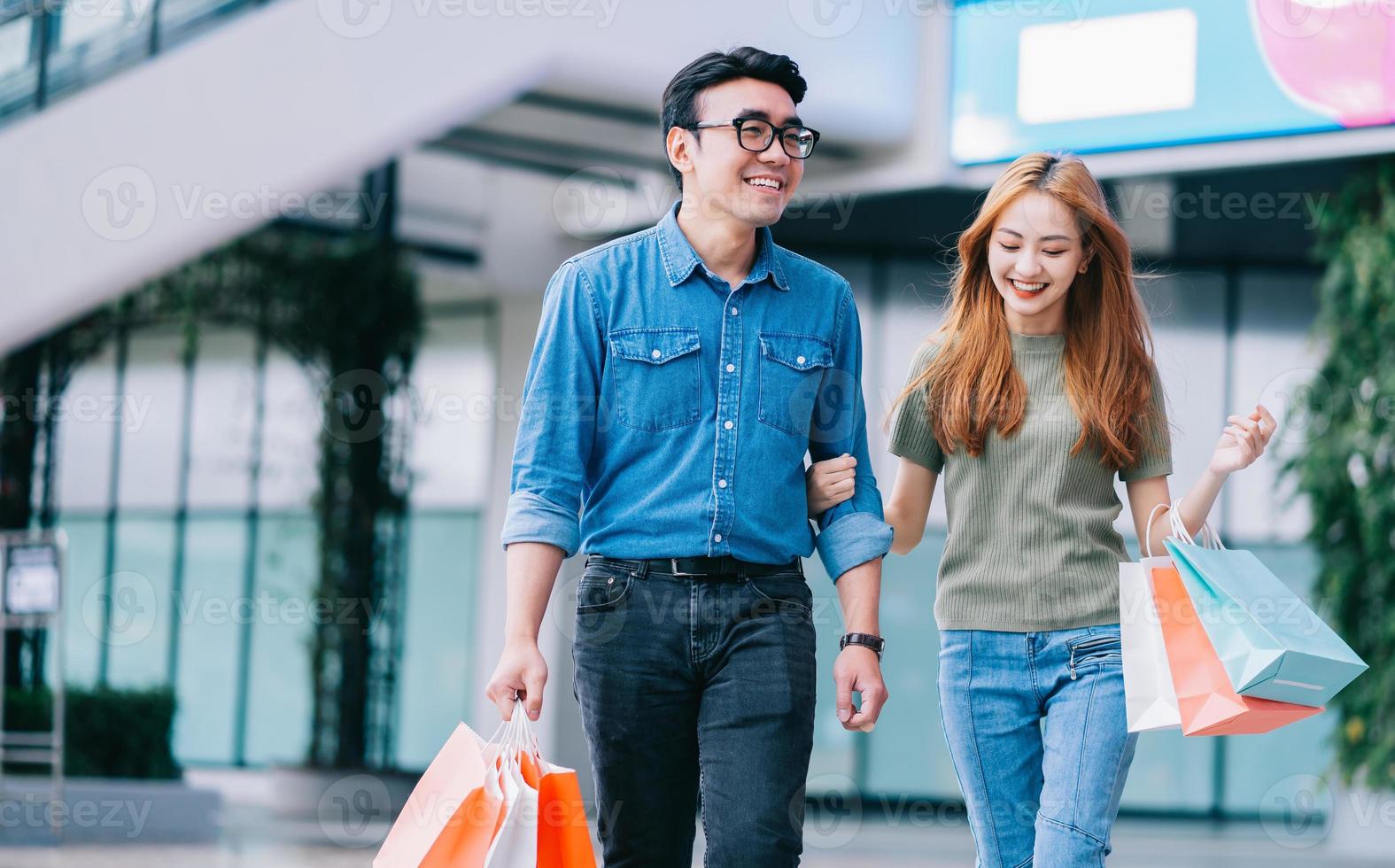 Asian couple shopping at the mall photo