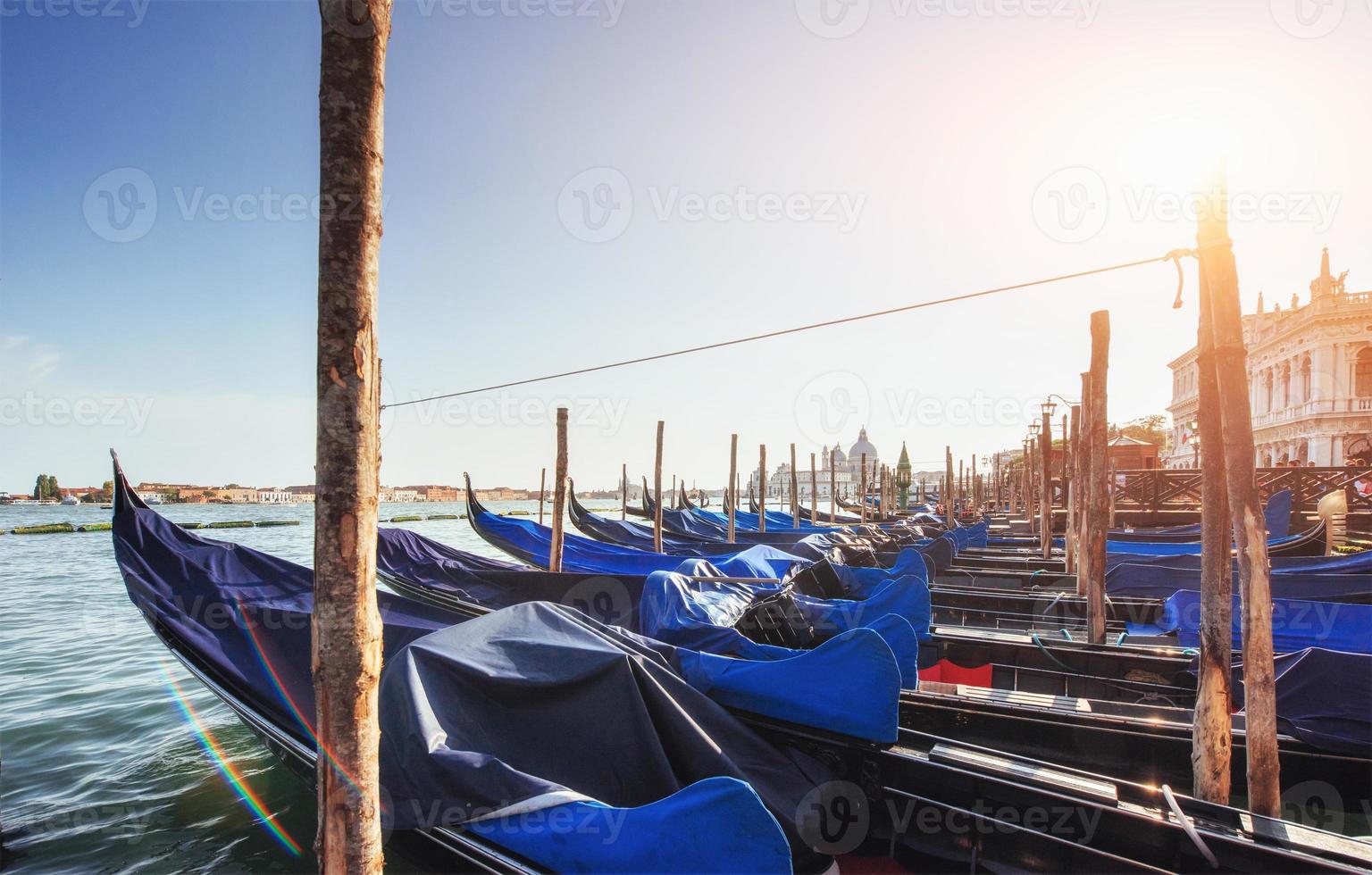 Gondolas on Grand canal in Venice, San Giorgio Maggiore church. San Marco. photo