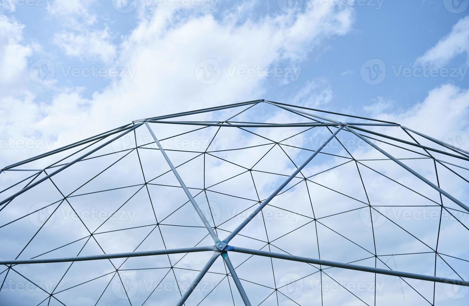 Metal structure against the blue sky. photo