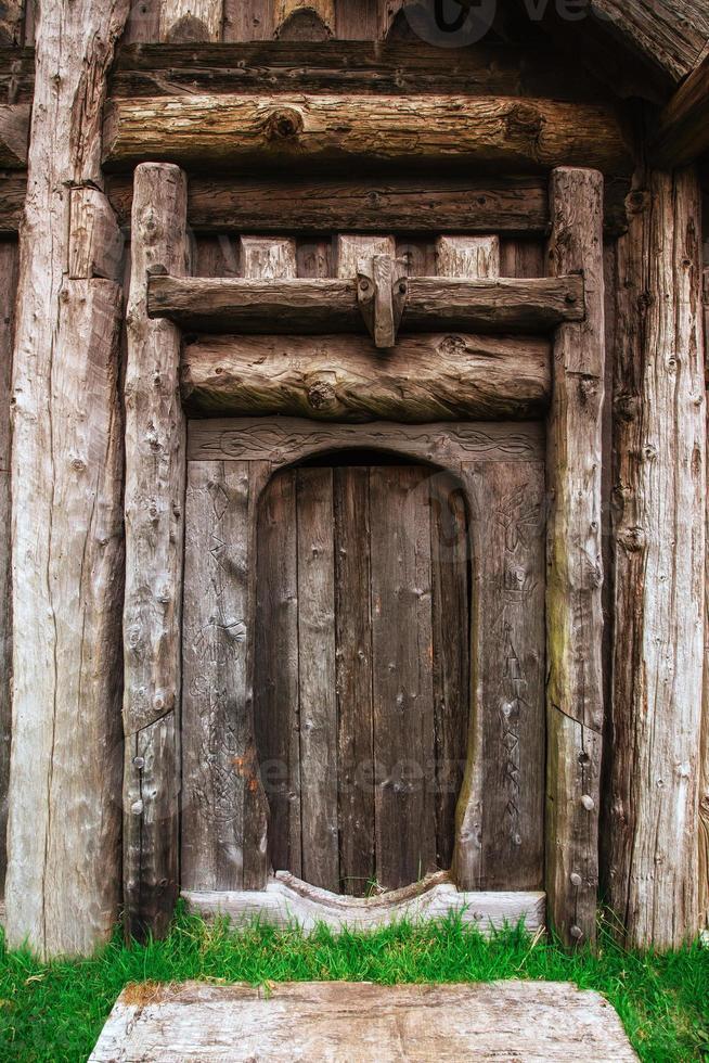 Traditional Viking village. Wooden houses near the mountain first settlements in Iceland. photo