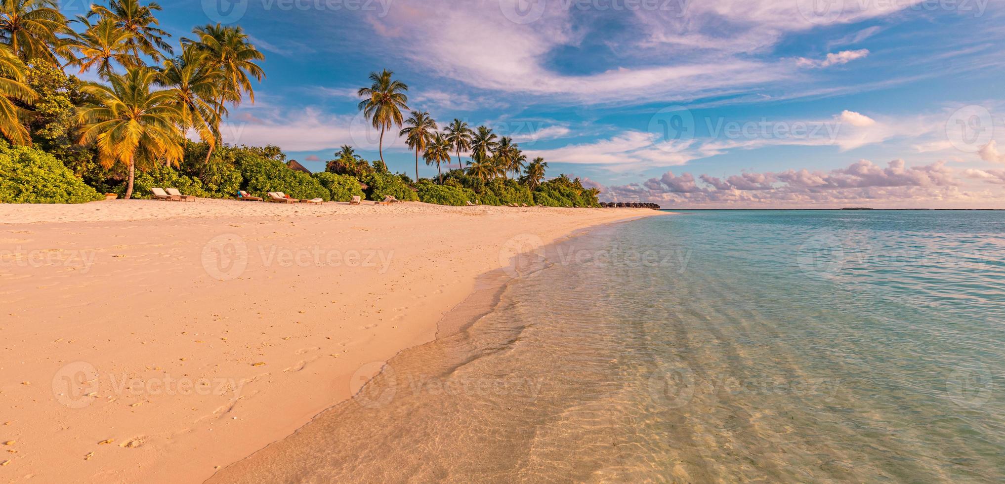 Island palm tree sea sand beach. Panoramic beach landscape. Inspire tropical beach seascape horizon. Orange and golden sunset sky calmness tranquil relaxing summer mood. Vacation travel holiday banner photo