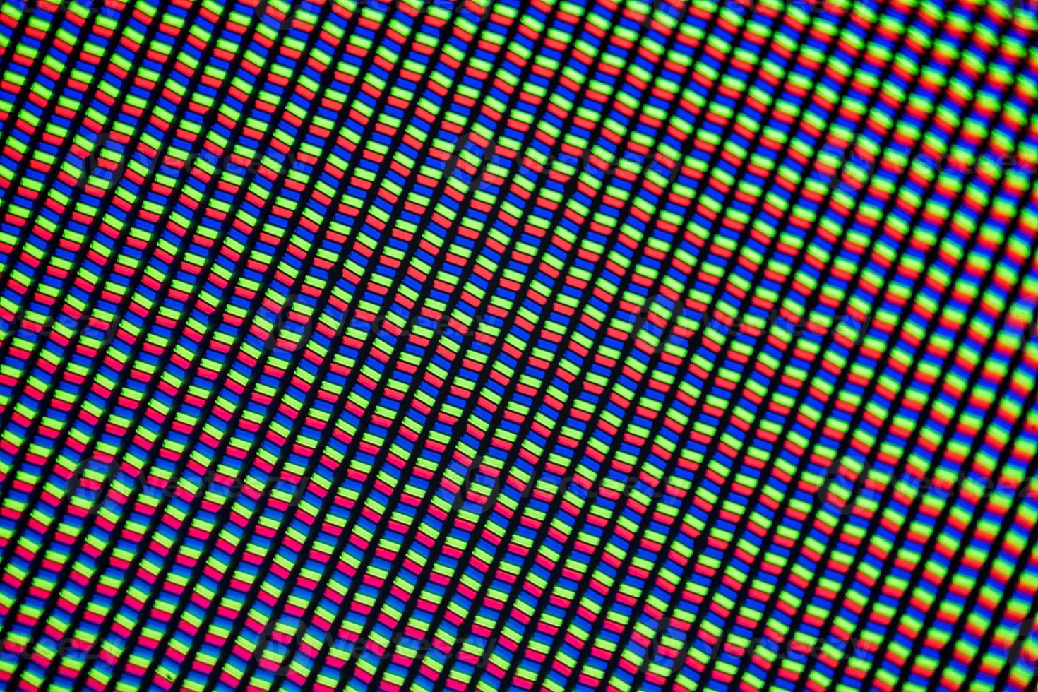 Light photomicrograph of a mobile LCD screen seen through a microscope photo