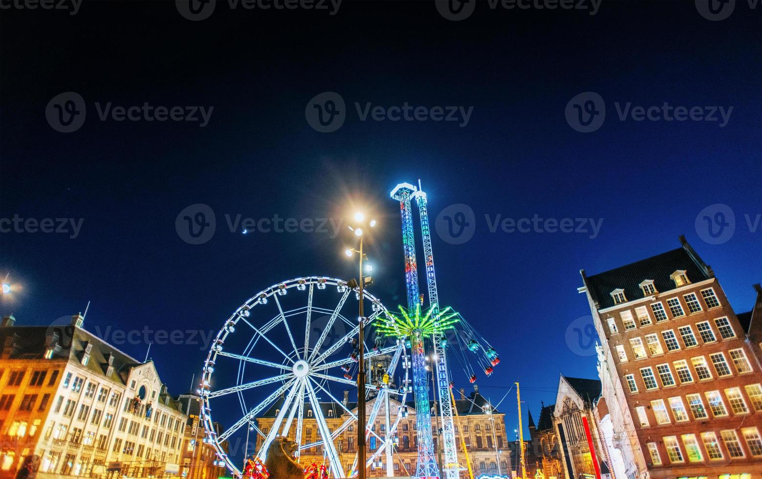 Night view of amusement park carousel photo