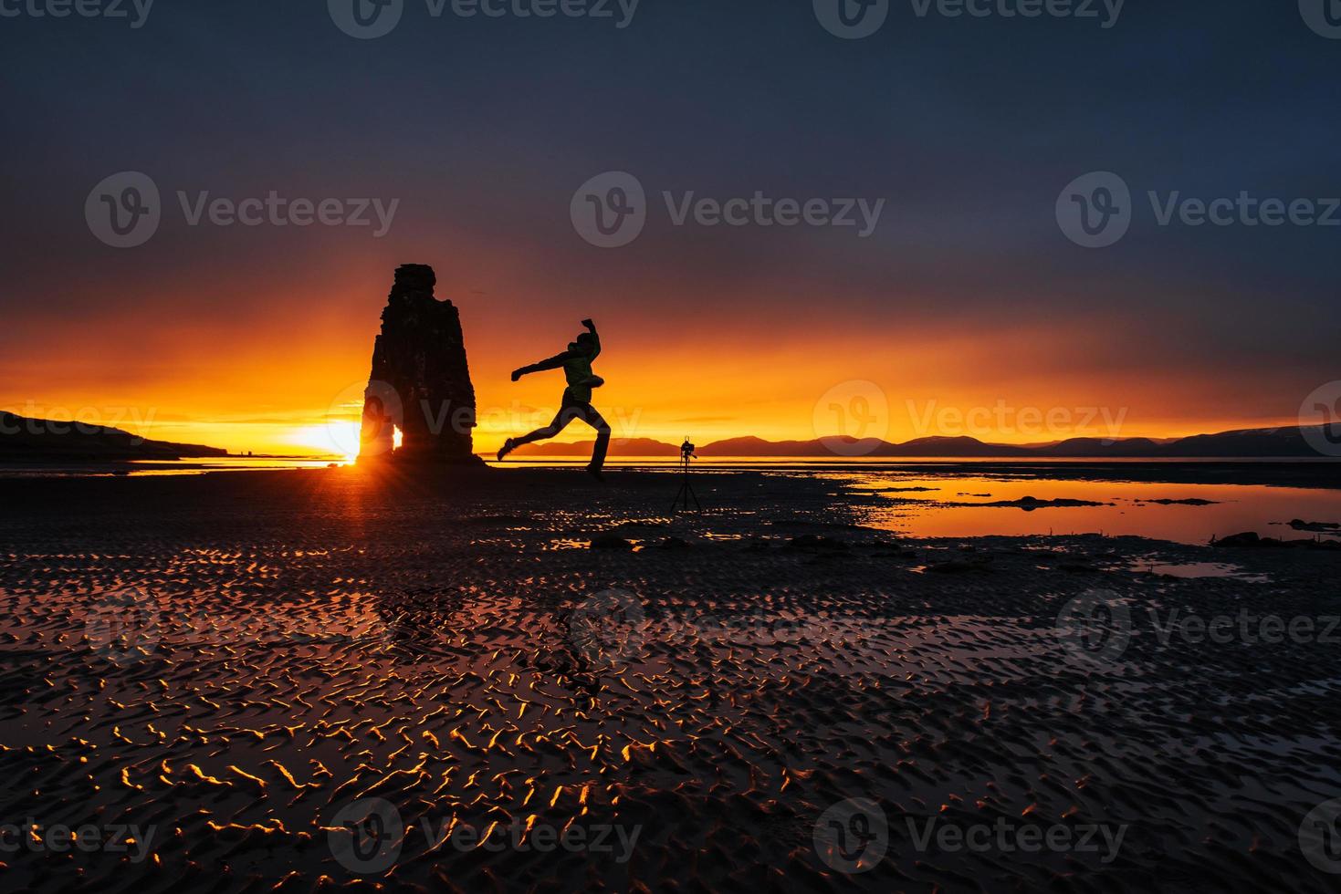 Is a spectacular rock in the sea on the Northern coast of Iceland. On this photo Hvitserkur reflects in the sea water after the midnight sunset