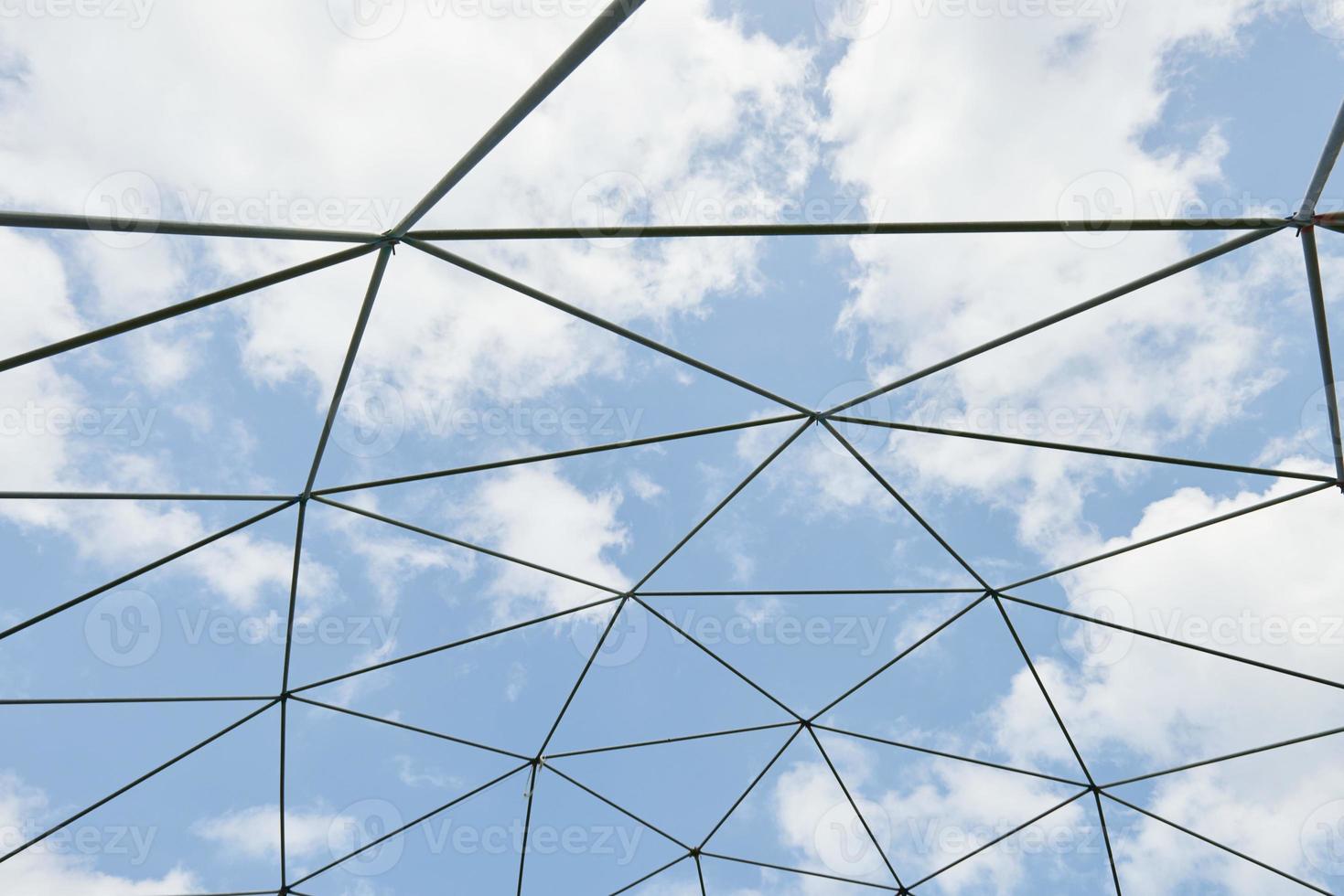 Metal structure against the blue sky. photo