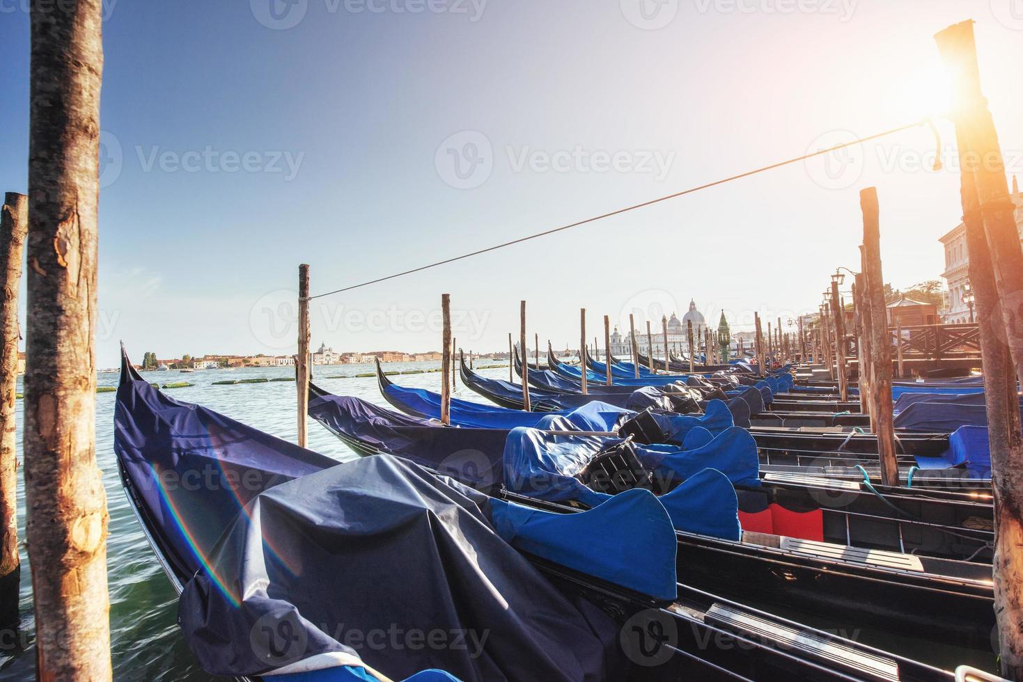 Gondolas on Grand canal in Venice, San Giorgio Maggiore church. San Marco. photo