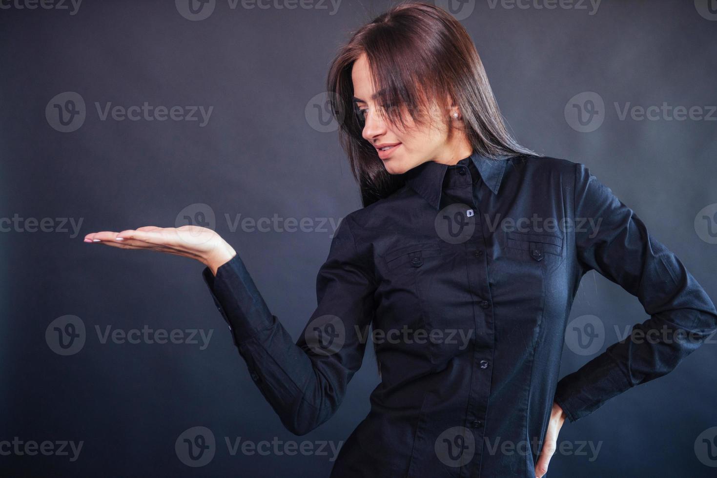 Portrait of beautiful smart young businesswoman in business attire photo