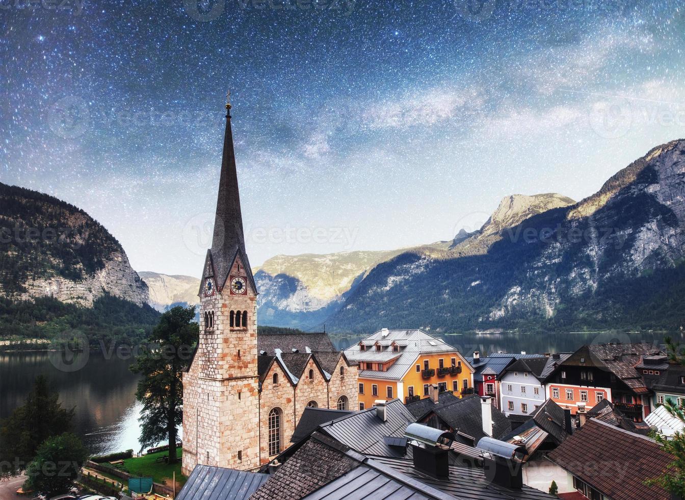 Scenic panoramic view of the famous mountain village in the Austrian Alps. Fantastic milky way. Hallstatt. Austria photo