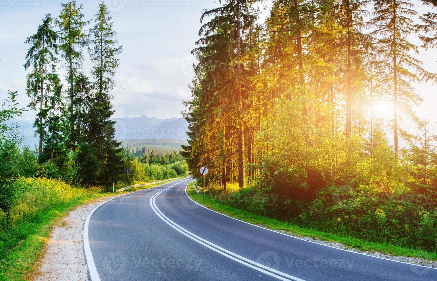 Asphalt road in mountains. The beauty of the world photo