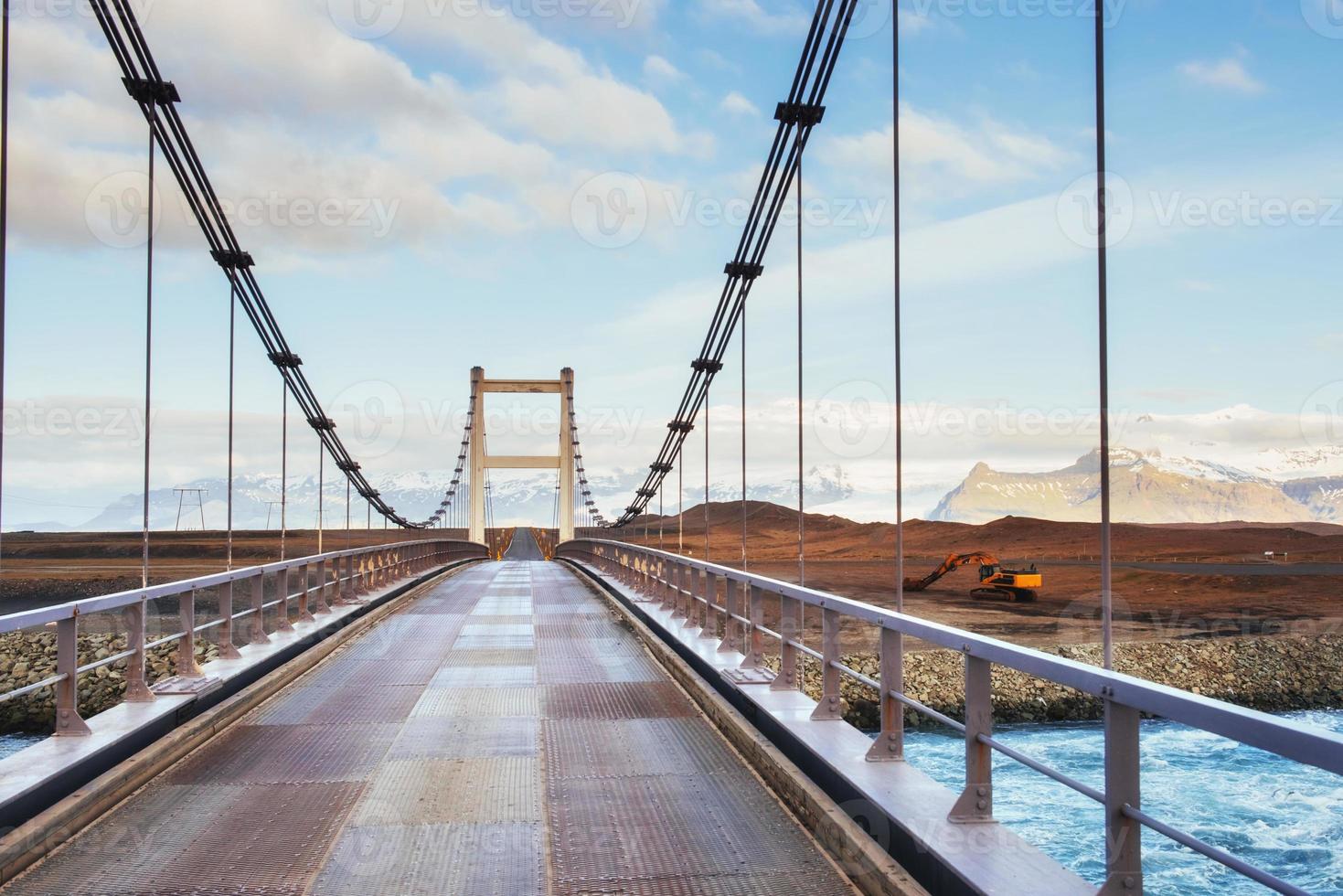 Bridge over a channel connecting Jokulsarlon Lagoon and Atlantic Ocean in southern Iceland photo