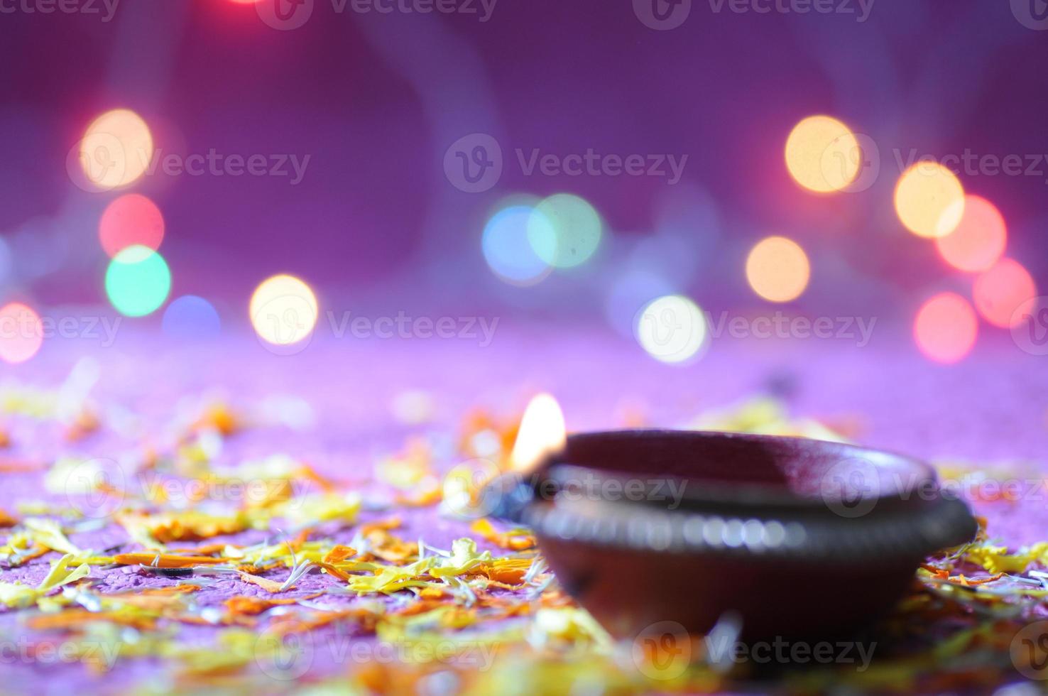 Clay diya lamps lit during Diwali Celebration. Greetings Card Design Indian Hindu Light Festival called Diwali photo