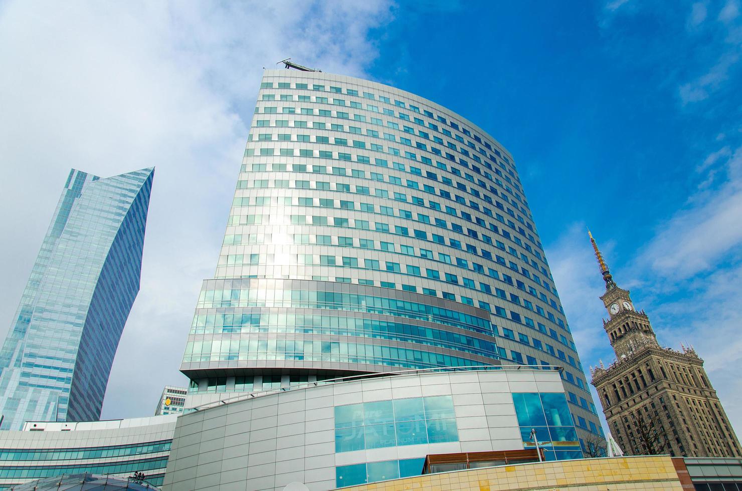 Warsaw, Poland - March 26, 2015 Downtown business skyscrapers and Palace of Culture and Science in the center of the city photo