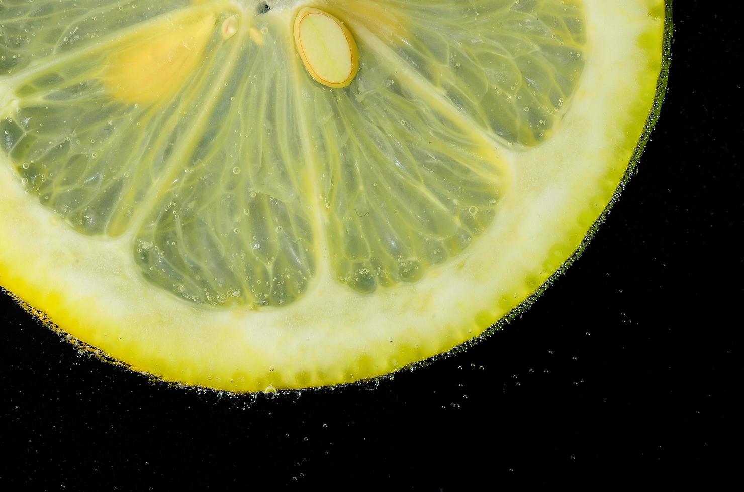 lemon in water bubbles detail photo