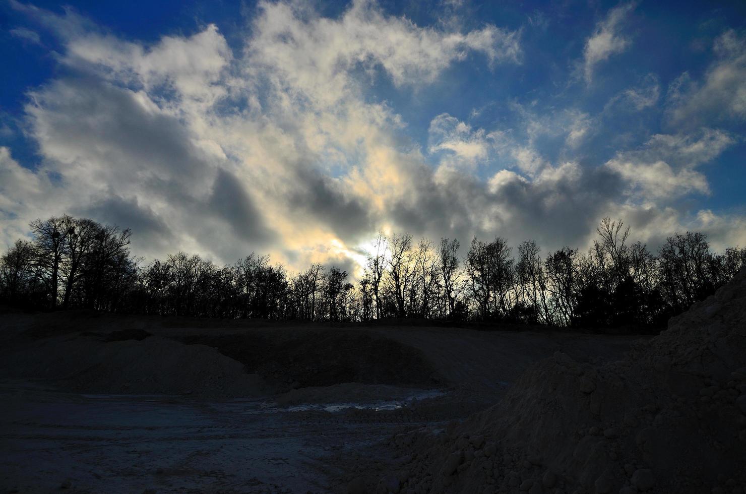 quarry with trees at sunset photo